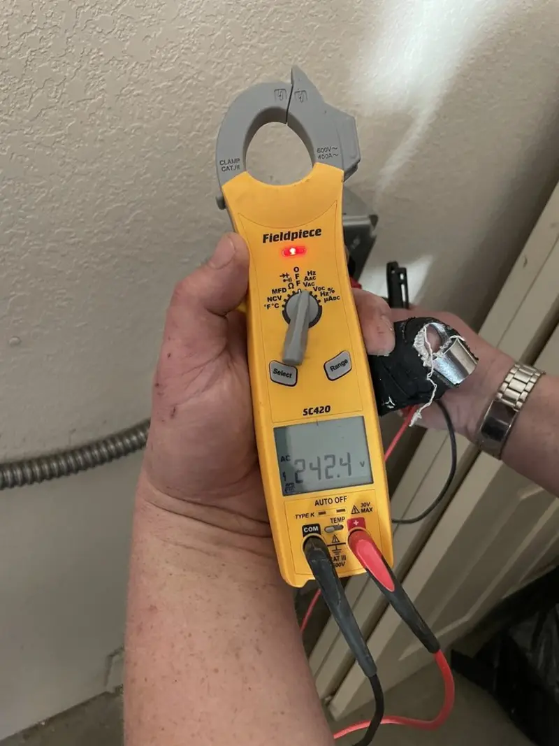 Voltage testing with clamp meter during Ceiling Fan Installation in Chagrin Falls